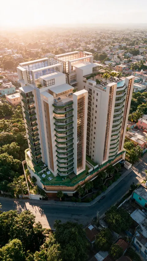Torres residenciais claras com varandas curvas de vidro verde, vistas do alto ao entardecer, com piscina na cobertura, jardins no térreo e a cidade baixa ao redor.